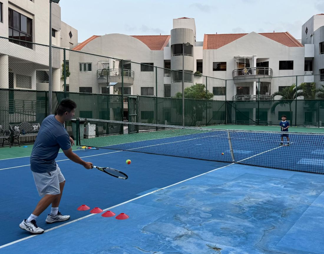 A junior coaching session in progress on a full court